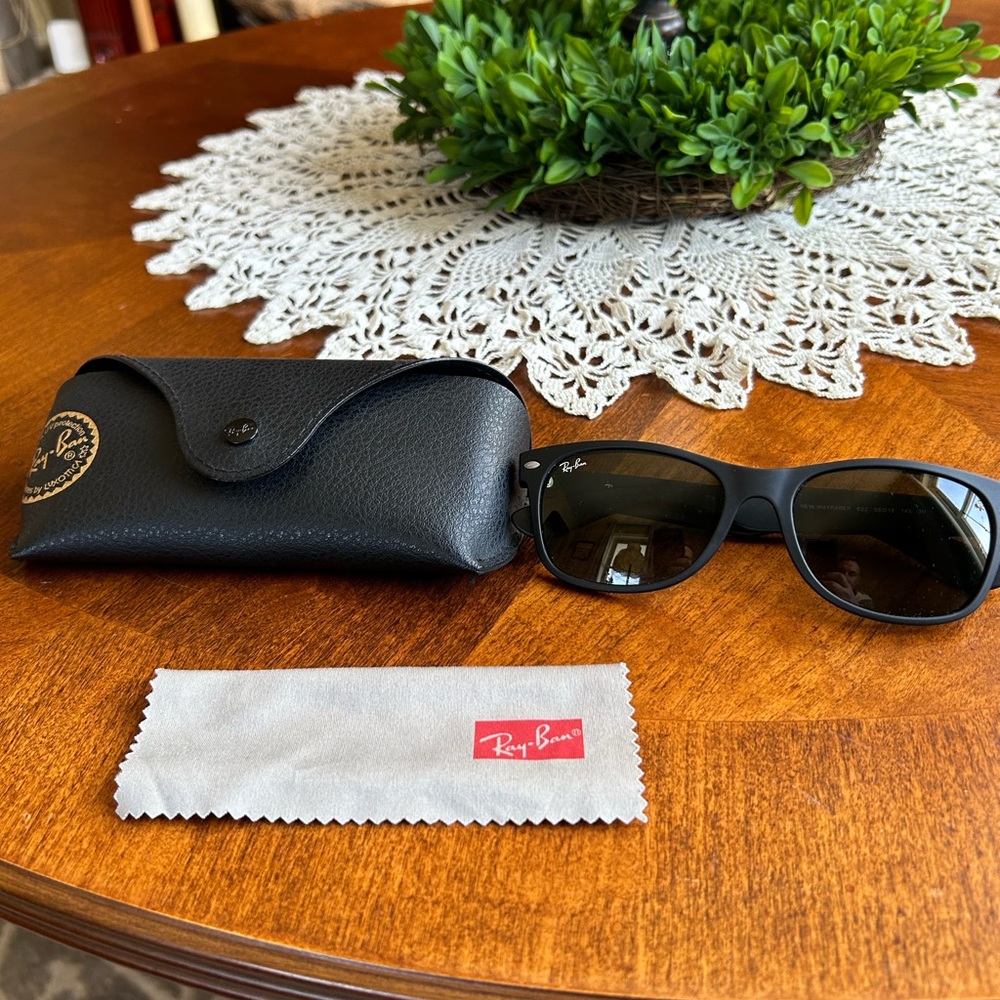 Ray-Ban New Wayfarer glasses.  Listing includes Ray-Ban case and cleaning cloth.